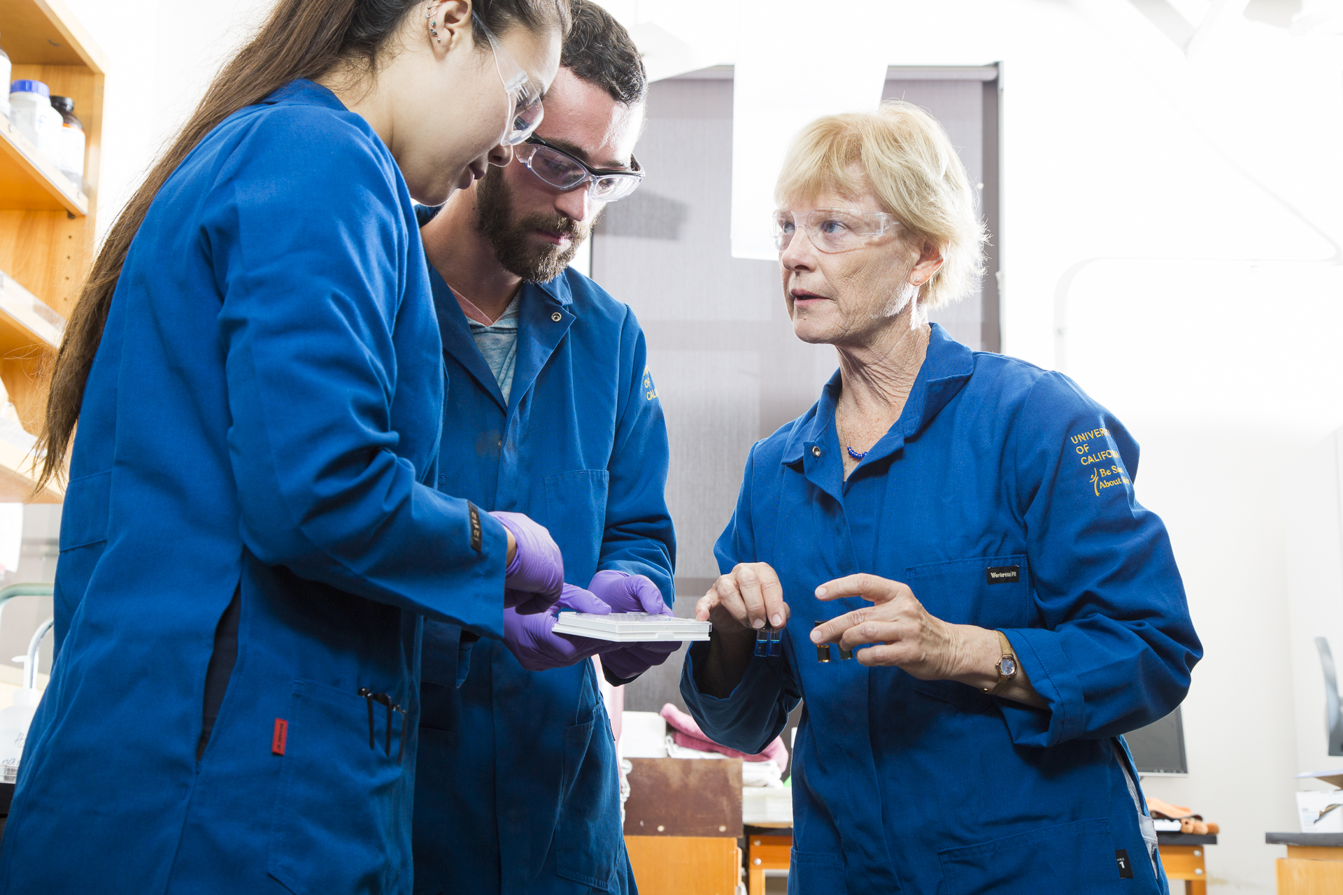 researchers and faculty inside lab